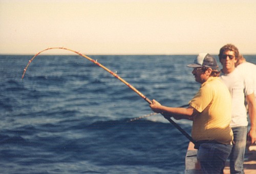 Peter holding a bent rod